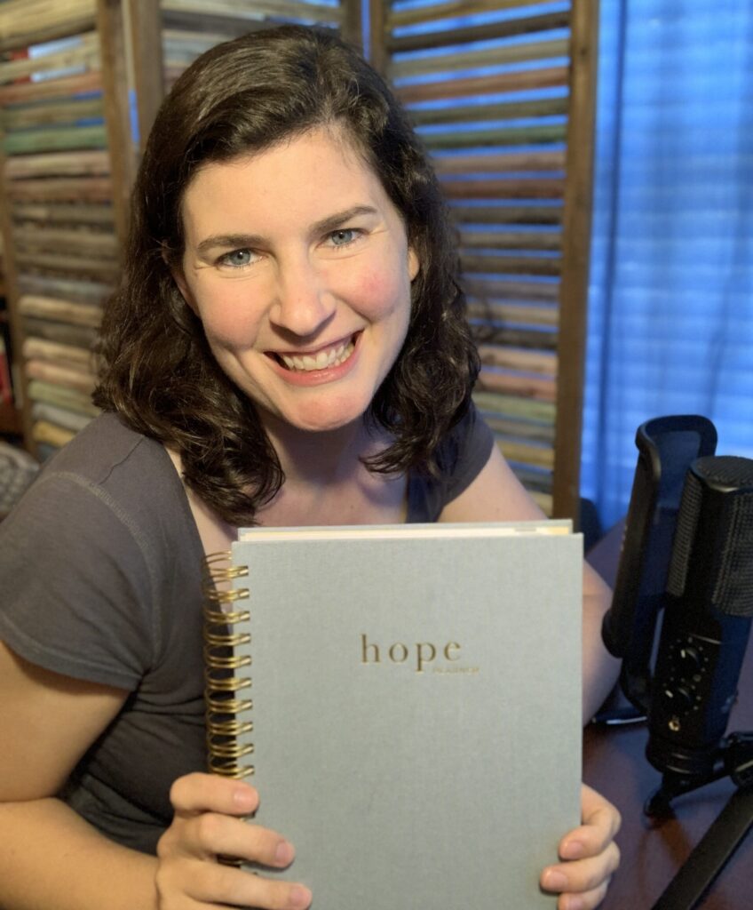 picture of Christian woman holding The Hope Planner