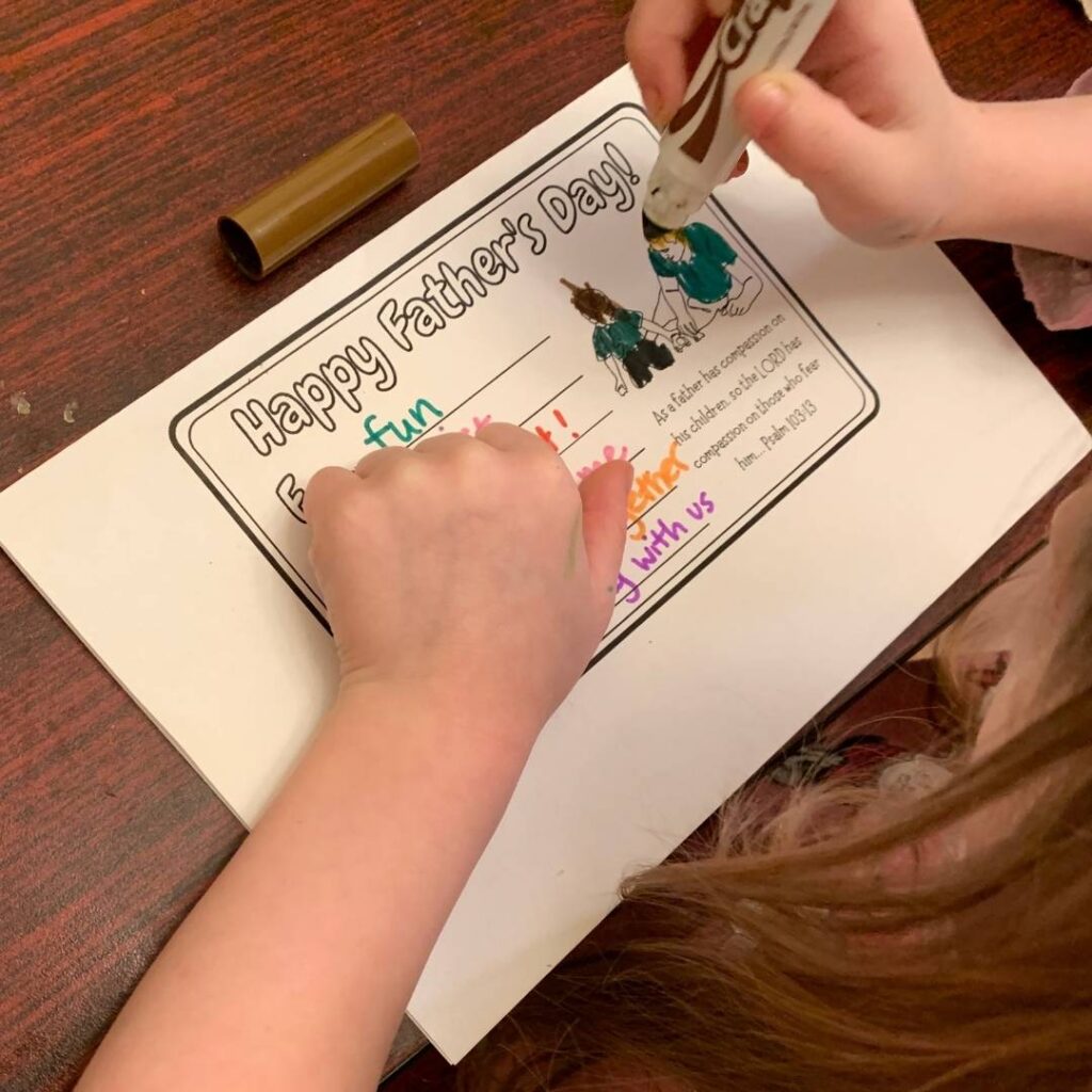 image of a child drawing a homemade Father's Day card