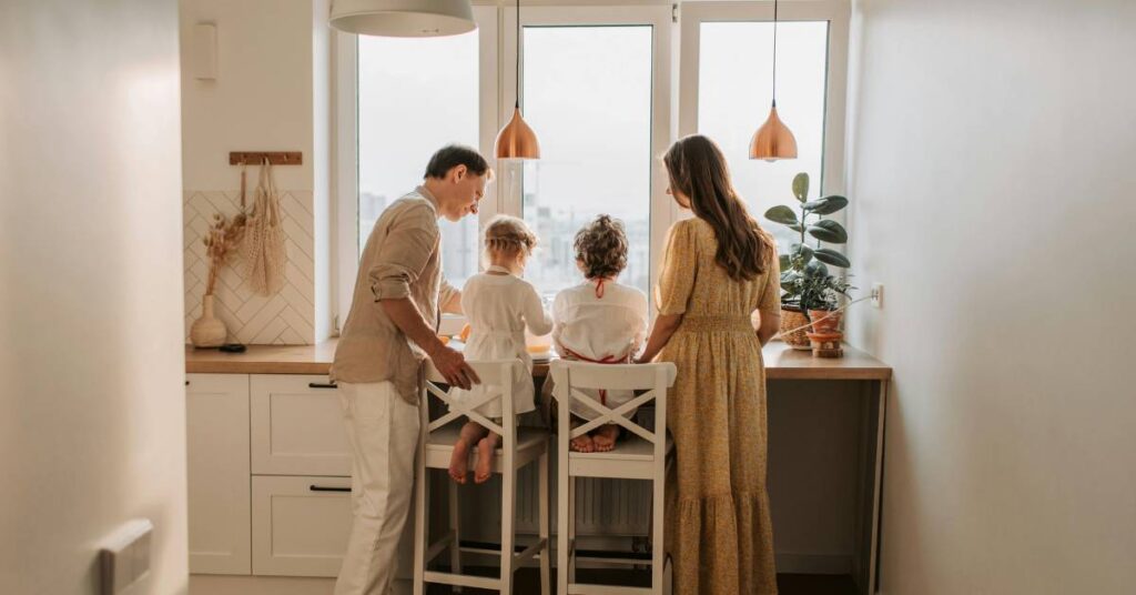 Christian parents gathered around their two children for family discipleship activities